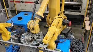 Plastic industry automation solutions including robotic trimming and injection molding